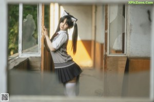 A naked asian woman in a white shirt and red bow tie.