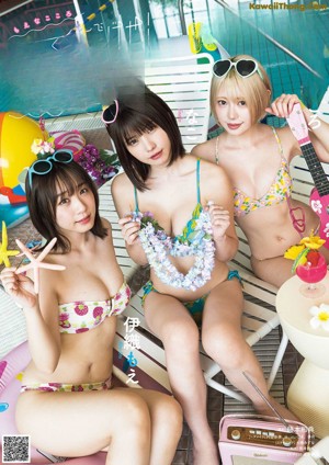 A group of three young women in lingersuits posing for a magazine cover.